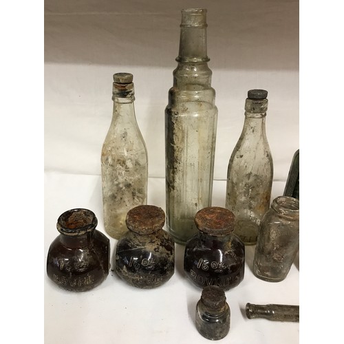 432 - A collection of glass bottles to include three 16oz Bovril, Gordon's special dry London gin and an E... 