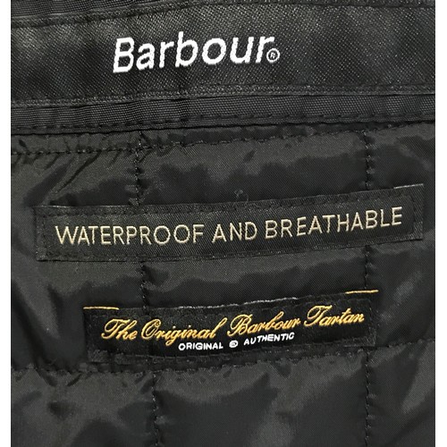 939 - A ladies Barbour jacket size 14 with hood, belt and fluffy collar.