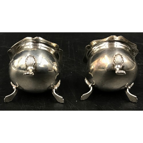 702 - A pair of silver salts on three pad feet, hallmarked Chester 1918 makers mark Barker Brothers (Herbe... 