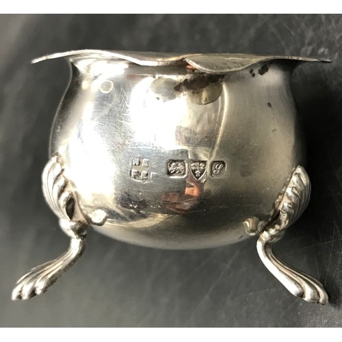 702 - A pair of silver salts on three pad feet, hallmarked Chester 1918 makers mark Barker Brothers (Herbe... 