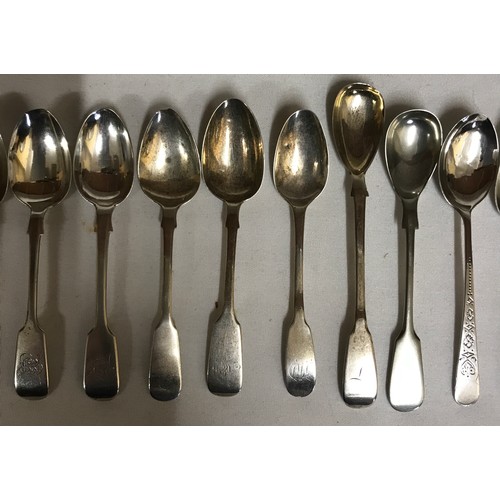 703 - Fourteen hallmarked silver spoons to include 5 matching fiddle pattern teaspoons Exeter 1881, 3 old ... 