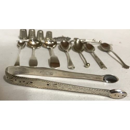 704 - A collection of silver items to include Georgian tongs hallmarked 1790 Exeter Josheph Hicks, 4x thim... 