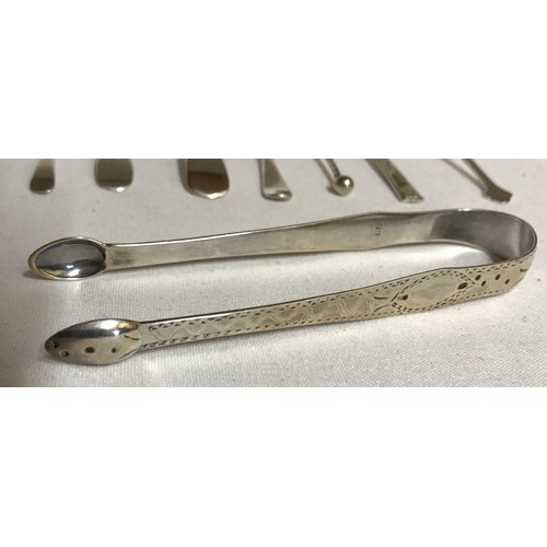 704 - A collection of silver items to include Georgian tongs hallmarked 1790 Exeter Josheph Hicks, 4x thim... 