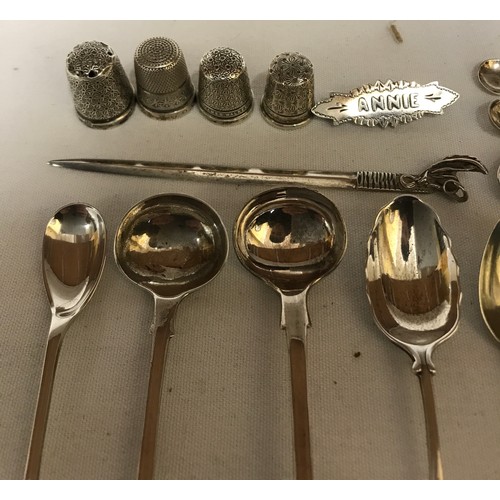 704 - A collection of silver items to include Georgian tongs hallmarked 1790 Exeter Josheph Hicks, 4x thim... 