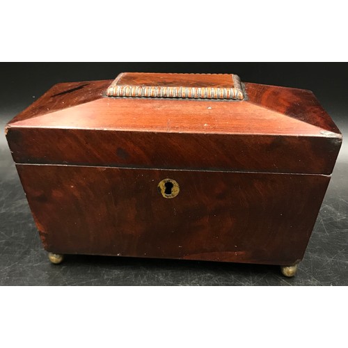 1005 - A mahogany sarcophagus caddy with key and two interior lidded compartments on ball feet. 13 d x 22.5... 