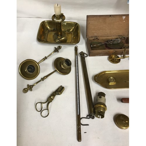 1047 - A selection of brass items to include chamber stick, three coin balances, pen tray, letter opener, t... 