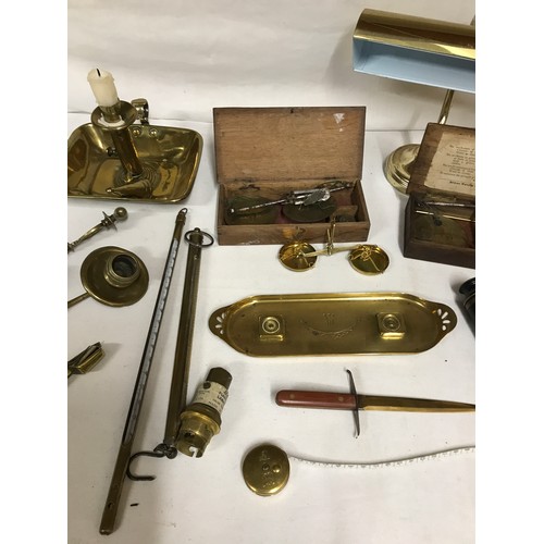 1047 - A selection of brass items to include chamber stick, three coin balances, pen tray, letter opener, t... 