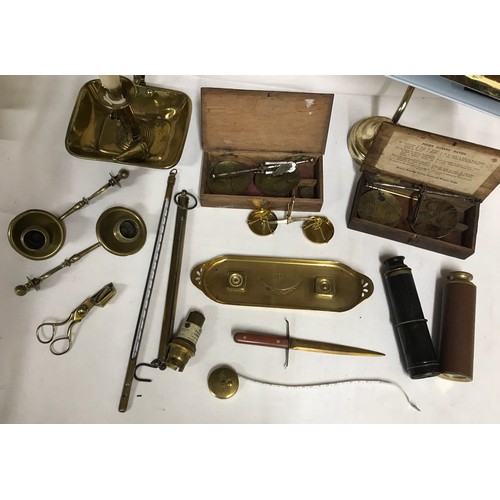 1047 - A selection of brass items to include chamber stick, three coin balances, pen tray, letter opener, t... 