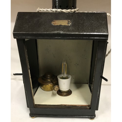 1128 - Three pieces of lighting a converted darkroom lamp with oil burner with retailer's plate for 'Reynol... 