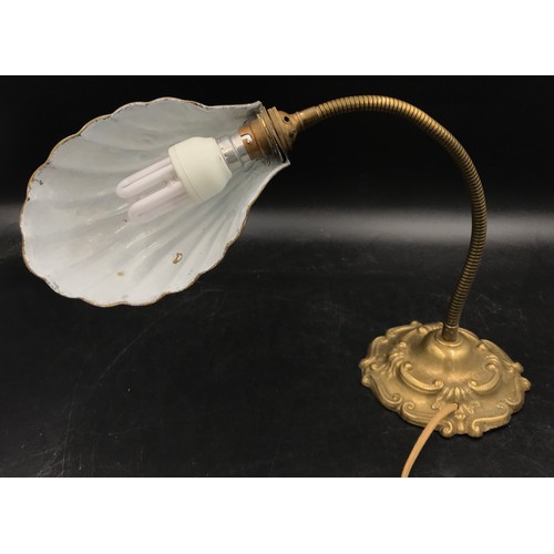 1129 - A brass desk lamp with shell shaped shade and adjustable neck measuring 55cm h.