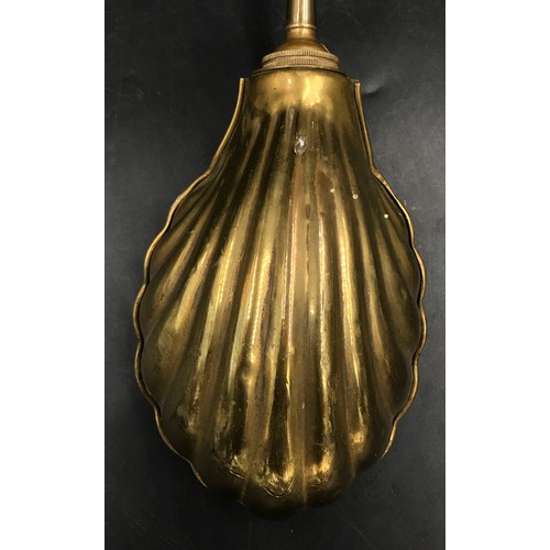 1129 - A brass desk lamp with shell shaped shade and adjustable neck measuring 55cm h.