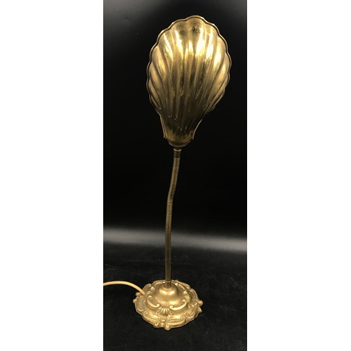 1129 - A brass desk lamp with shell shaped shade and adjustable neck measuring 55cm h.