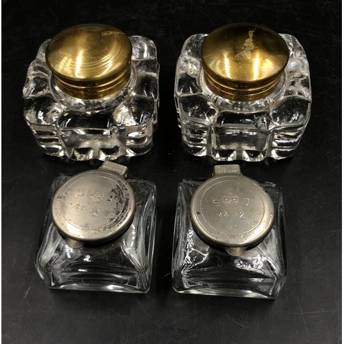 438 - Two pairs of glass ink wells to include one pair of Victorian inks with brass tops the other pair wi... 