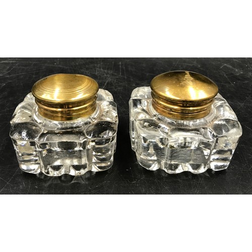 438 - Two pairs of glass ink wells to include one pair of Victorian inks with brass tops the other pair wi... 