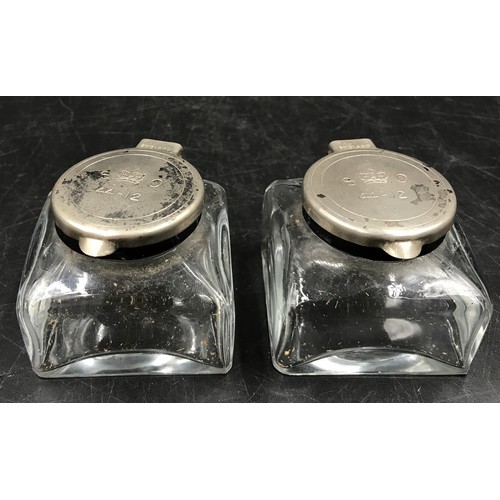 438 - Two pairs of glass ink wells to include one pair of Victorian inks with brass tops the other pair wi... 