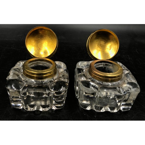 438 - Two pairs of glass ink wells to include one pair of Victorian inks with brass tops the other pair wi... 