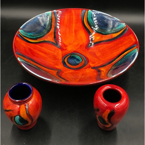 363 - Poole pottery Volcano pattern two small vases and a large bowl 34cm diameter.