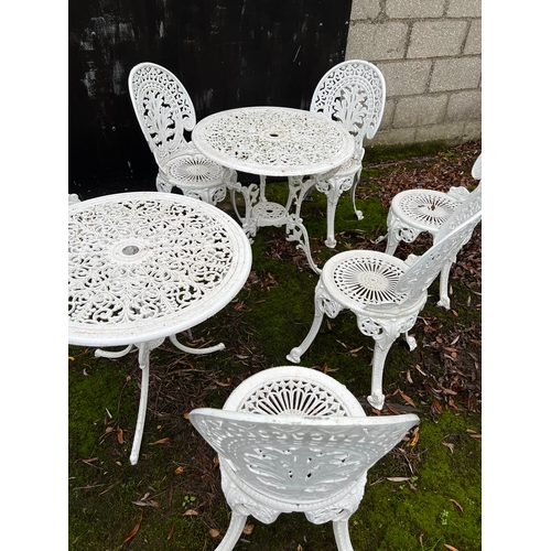 184 - Two metal garden tables and 6 chairs. Tables 69cm d.