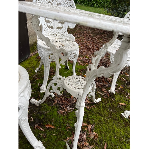 184 - Two metal garden tables and 6 chairs. Tables 69cm d.