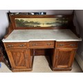 A 19thC mahogany washstand with marble top and painted upstand depicting lake and mountains. 3 drawe... 