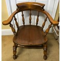 A 19thC oak Captain's chair. 76 h x 71cm at widest.
