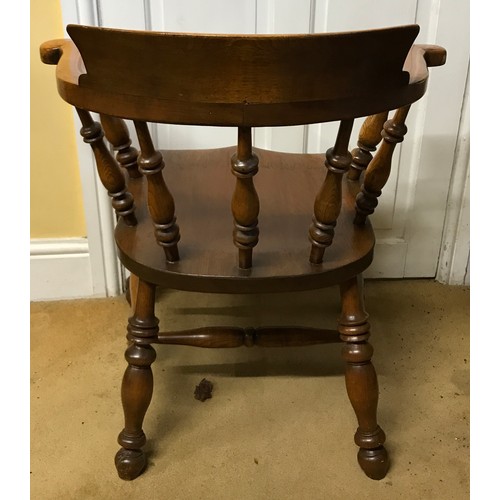 7 - A 19thC oak Captain's chair. 76 h x 71cm at widest.