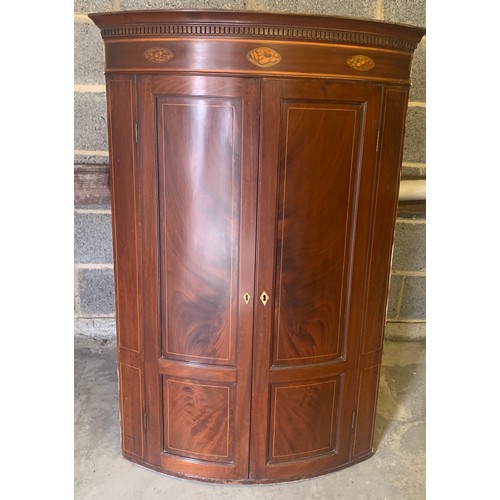 8 - A 19thC mahogany and inlay two door corner cupboard with shelved interior and shell decoration. 120 ... 