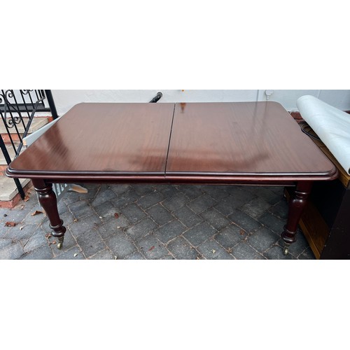 9 - A 19thC mahogany wind out extending dining table. 182cm without leaves. 289cm with leaves.