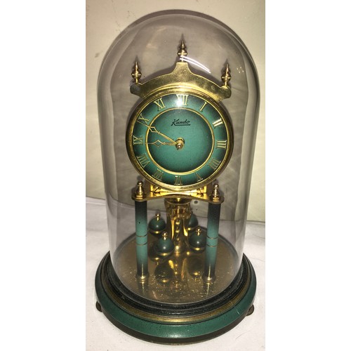 1182 - An oak aneroid barometer with thermometer. 84 h x 26cm w together with a gilt and green Kundo annive... 