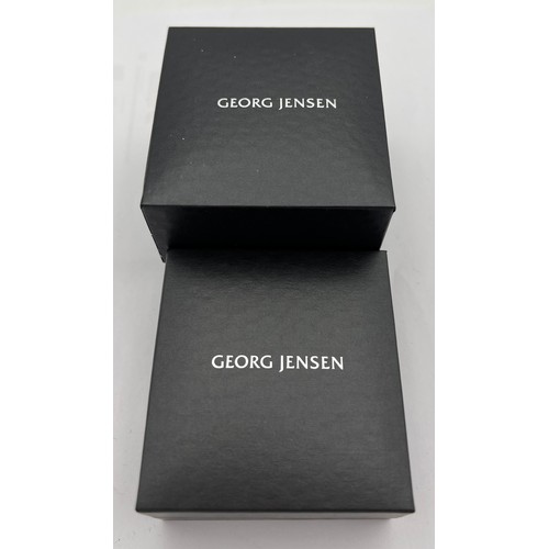 496 - Georg Jensen jewellery to include  silver ring and pendant set with black diamonds, both in original... 