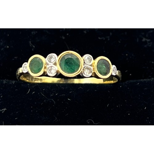 494 - Eighteen carat gold ring set with emeralds and diamonds. Size Q. Weight 2g.