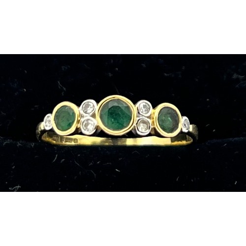 494 - Eighteen carat gold ring set with emeralds and diamonds. Size Q. Weight 2g.