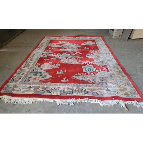 1211 - A large red ground Chinese carpet. 370cm x270cm.