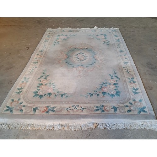 1212 - Large Chinese rug on pale ground. 290cm x 185cm.