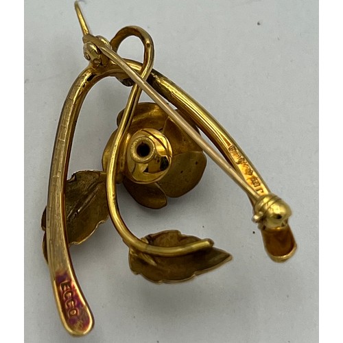 524 - Nine carat gold wishbone and rose brooch.Weight 3.9g.