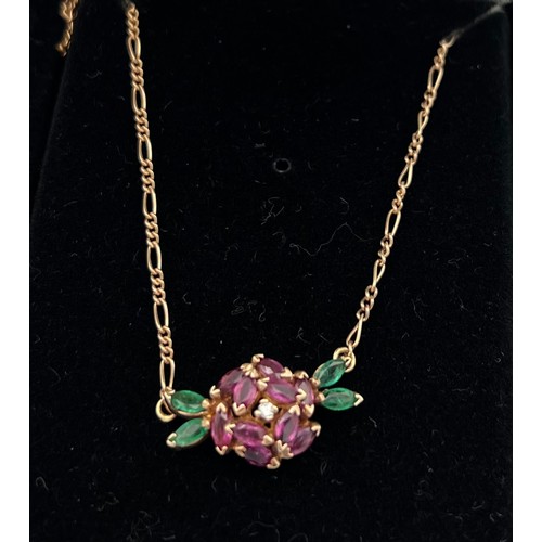 504 - A 14 carat gold gem set pendant. Total weight 3.8gm. Length approximately 40cm.