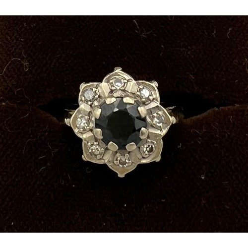 509 - Eighteen carat gold diamond and sapphire cluster ring. Size L. Weight 4.2gm.