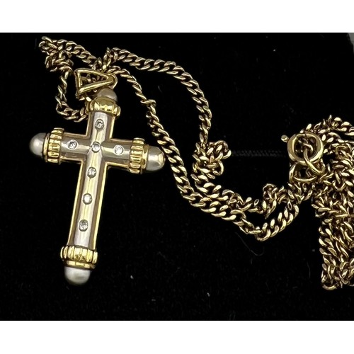 510 - Fourteen carat white and yellow gold crucifix set with diamonds on a 9 carat yellow gold chain. Leng... 