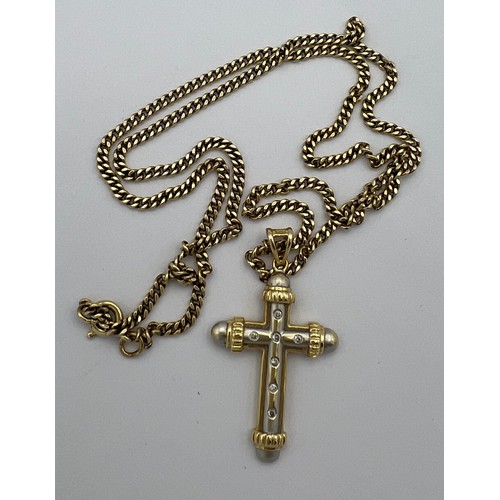 510 - Fourteen carat white and yellow gold crucifix set with diamonds on a 9 carat yellow gold chain. Leng... 