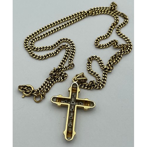 510 - Fourteen carat white and yellow gold crucifix set with diamonds on a 9 carat yellow gold chain. Leng... 