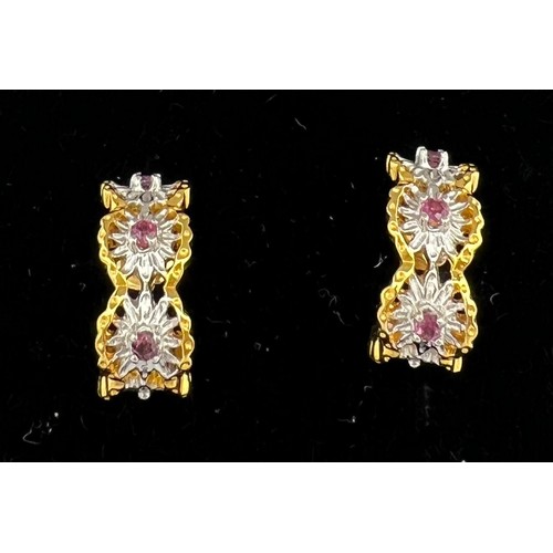 500 - A pair of fourteen carat gold earrings for pierced ears set with pink gem  stones. Total weight 6.3g... 