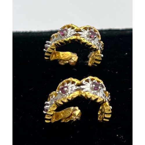 500 - A pair of fourteen carat gold earrings for pierced ears set with pink gem  stones. Total weight 6.3g... 