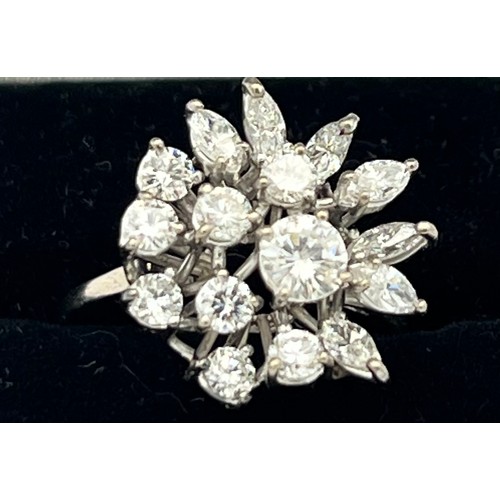 586 - A diamond cluster ring set in 18 carat white gold. Size M, weight 4.5g.