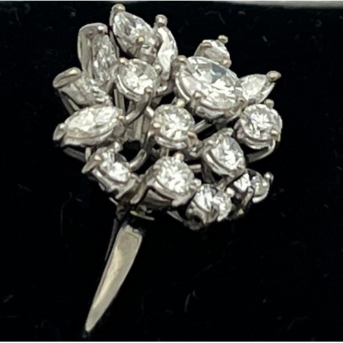 586 - A diamond cluster ring set in 18 carat white gold. Size M, weight 4.5g.