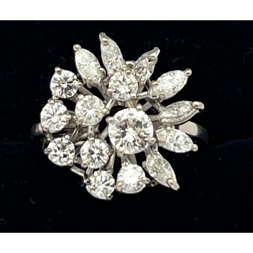 586 - A diamond cluster ring set in 18 carat white gold. Size M, weight 4.5g.