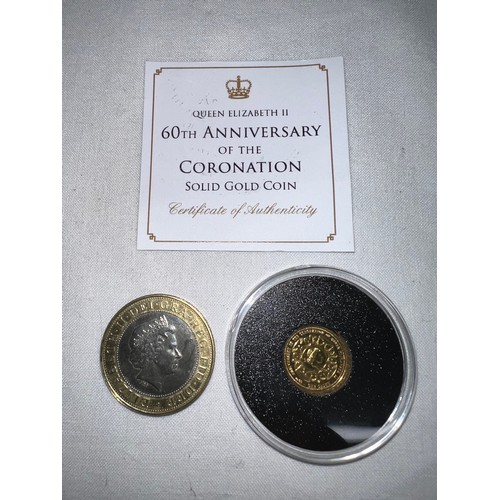 634 - A Commonwealth Games 2002 two pound coin with Queen Elizabeth II 60th Anniversary of the Coronation ... 