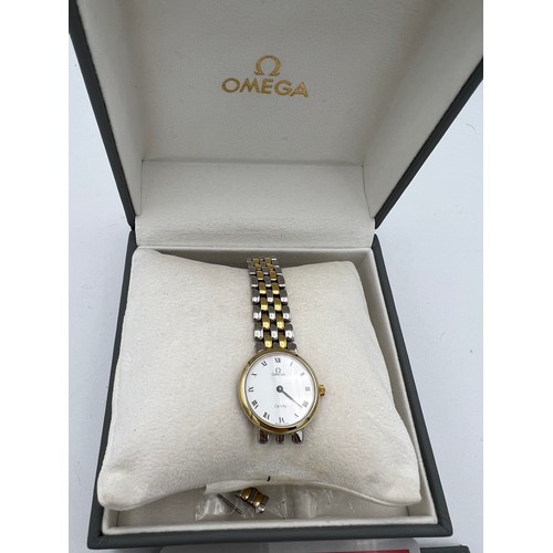 994 - An Omega De Ville ladies wristwatch with box and papers and spare links.