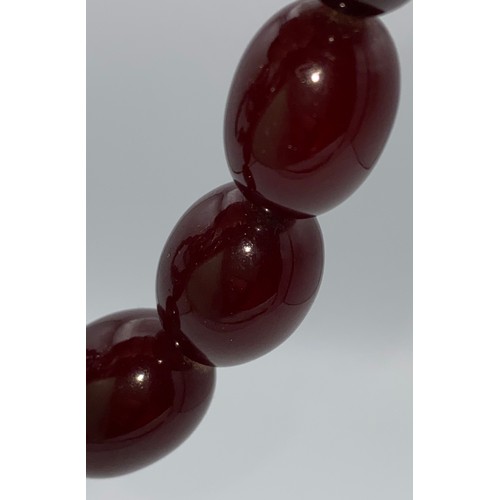 610 - Cherry amber bead necklace. Weight 64gm.