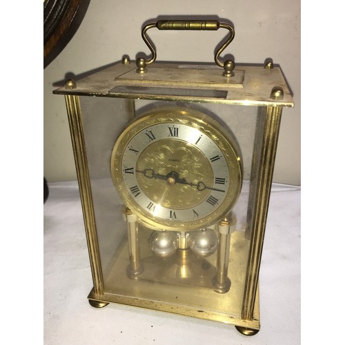 1182 - An oak aneroid barometer with thermometer. 84 h x 26cm w together with a gilt and green Kundo annive... 