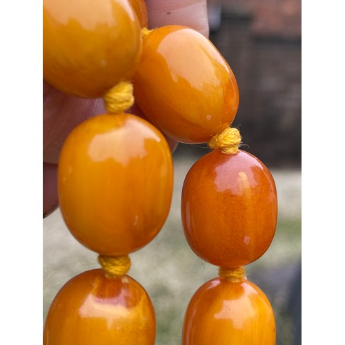 541 - Two string of butterscotch amber beads, approx length 80 & 52cm. 213.9gm.